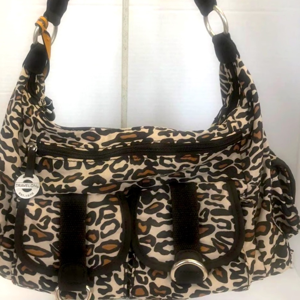 Travelon’s ocelot print bag purse with multiple pockets for travel or shopping
